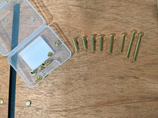 Extra screws and binding posts for guest books